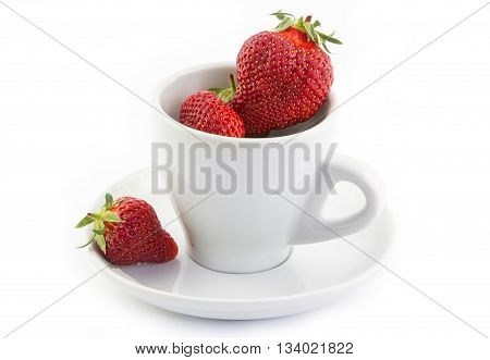 Fresh strawberries in a white cup on a white background