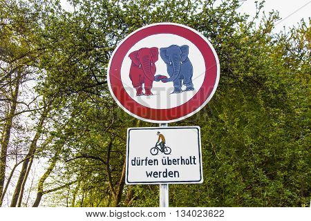 SCHWALBACH, GERMANY - JUNE 3, 2011: traffic sign elefants in Love in the forest in Schwalbach