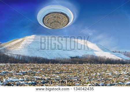 Photomontage landscape picture of a snowy mountain over it a giant hurricane