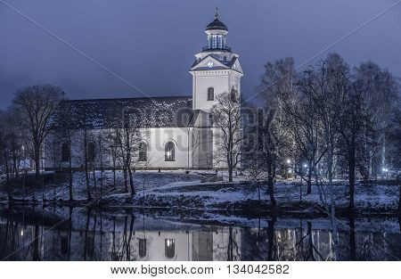 Beautiful night shot of church in blue and purple lighting