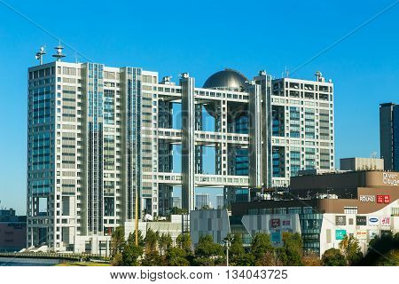 TOKYO JAPAN - NOVEMBER 27 2015: Fuji T.V. headquarters one of the most striking buildings in Japan. its' futuristic metallic clad building featuring a massive silver ball 32 metres in diameter