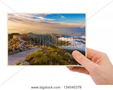 Hand and Lovcen Mountains - Montenegro (my photo) isolated on white background