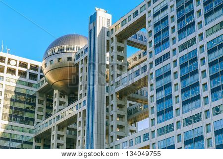 TOKYO JAPAN - NOVEMBER 27 2015: Fuji T.V. headquarters one of the most striking buildings in Japan. its' futuristic metallic clad building featuring a massive silver ball 32 metres in diameter