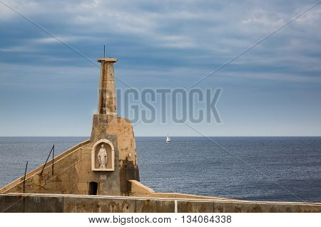The guardian of small and large ships sailing from a port on the Mediterranean Cirkewwa on the Malta island