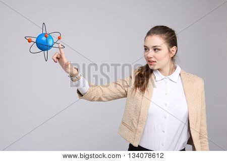 Woman scientist with atom model, research concept