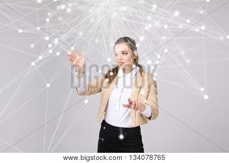 Worldwide network or wireless internet connection futuristic concept. Woman working with linked dots.