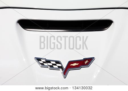 Tel Aviv, Israel, June 12, 2016: Corvette emblem and car front. The Chevrolet Corvette, known colloquially as the Vette, is a sports car manufactured by Chevrolet.
