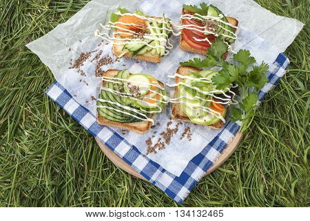 sandwiches with vegetables, fresh tomatoes, cucumbers and zucchini.