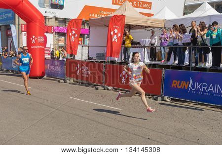 DNEPR UKRAINE - MAY 22 2016:Woman hurry to finish line during 