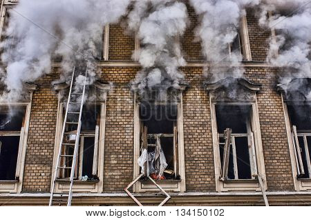 the fire in the old house. window fa ade close-up