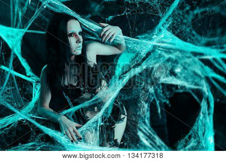 Girl like a spider getting out from the cocoon