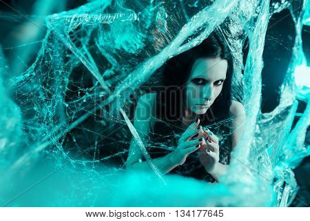 Girl like a spider getting out from the cocoon