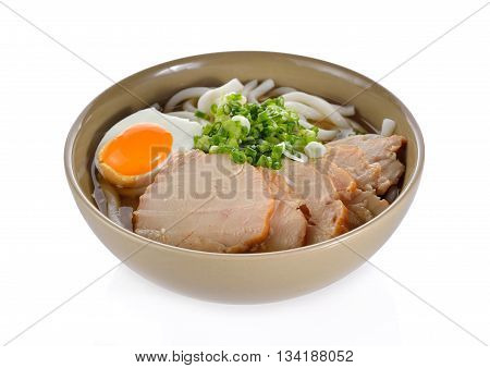 Japanese noodles Udon with chicken and boiled egg in soybean paste (Miso) soup on white background
