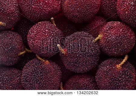 Yumberries in a square bowl isolated on white background
