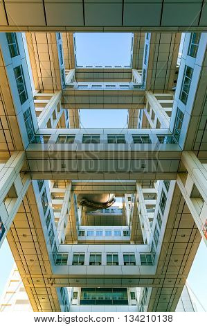TOKYO JAPAN - NOVEMBER 27 2015: Fuji T.V. headquarters one of the most striking buildings in Japan. its' futuristic metallic clad building featuring a massive silver ball 32 metres in diameter