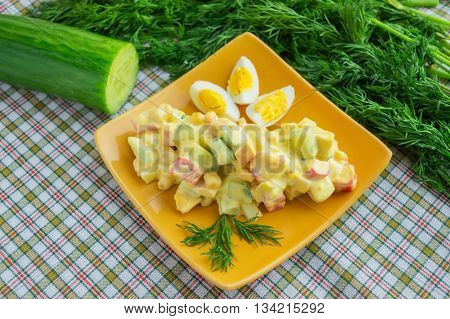 Light salad of cucumber crab meat corn and quail eggs with aioli sauce (all-i-oli)