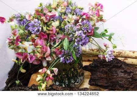 Summer bouquet of sweet peas and bituminarias