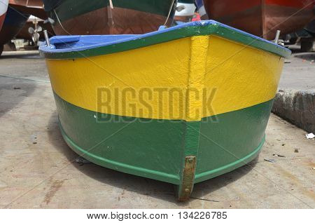 Newly painted yellow and green fishing boat at Camara de Lobos in Madeira Portugal