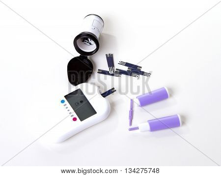 Diabetes composition glucometer measuring glucose level blood test using small drop of blood from finger and test strips.