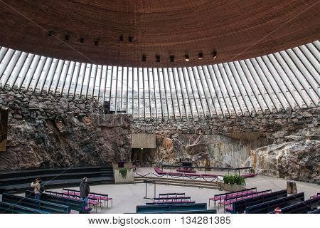 HELSINKI, FINLAND - circa MARCH 2016: The interior of the church in the rock (Temppeliaukio) in Helsinki, Finland. The rock church is a popular sightseeing destination for tourists in Helsinki.