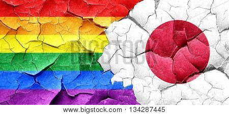 Gay pride flag with Japan flag on a grunge cracked wall