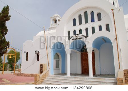 AGISTRI, GREECE - MAY 12, 2016: The domed church of Agioi Anargyroi at Skala on the Greek island of Agistri. The small island is under an hour from Piraeus harbour in Athens.