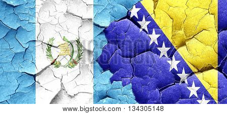 guatemala flag with Bosnia and Herzegovina flag on a grunge crac