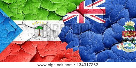 Equatorial guinea flag with Cayman islands flag on a grunge crac