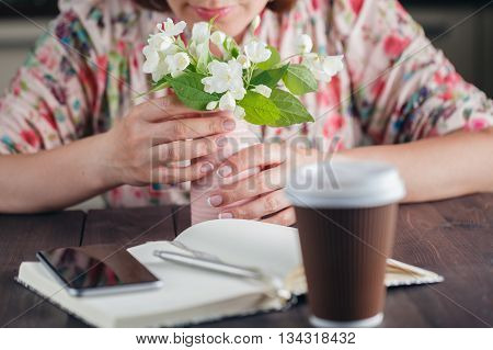 Coffee To Go. White Flowers On The Rustic Background.