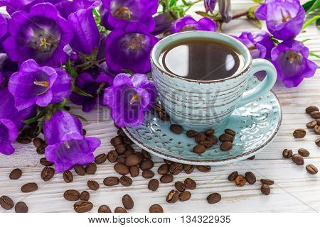 Cup Of Coffee, Coffee Beans And Lilac Flowers