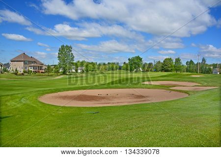 BROMONT QUEBEC CANADA 06 14 2016: Designed in 1992 by famous Graham Cooke, The Royal Bromont Golf Club offers an exceptional view of the surrounding mountains right in the heart of the City of Bromont