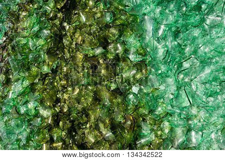 A pile of glass bottle pieces waiting to be moved away at trainyard