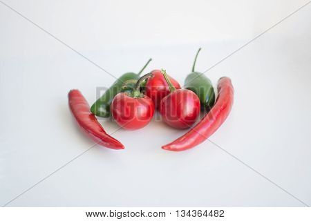 A bunch of red and green hot chilli peppers
