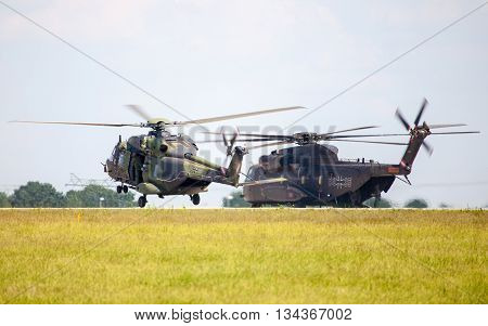 BERLIN / GERMANY - JUNE 3 2016: german military transport helicopters nh 90 and ch 53 lands on airfield in berlin germany at june 3 2016.