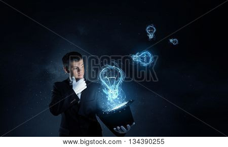 Man magician with cylinder hat