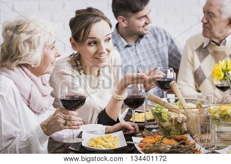 People enjoying traditional family mealtime at the table