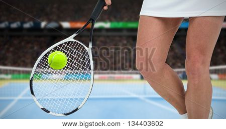 Athlete playing tennis with a racket against facing view of net on tennis field