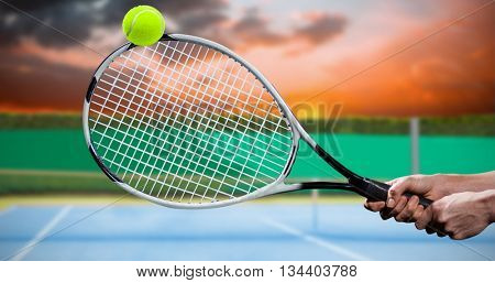 Tennis player playing tennis with a racket against digitally generated image of tennis court