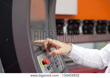 Programmable machine. Operator working at programmable machine.