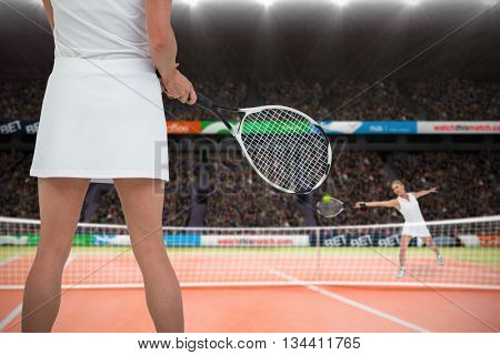 Athlete playing tennis with a racket against composite image of tennis woman playing on court