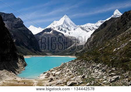 South America Beautiful Cordillera Blanca mountain. The picture presents lagoon Paron and snowcovered Piramide de Garcilaso peak Peru