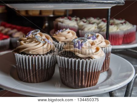 Cupcakes with Flowers and Horeshoe in Stack on display