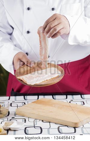 Chef present bacon for cooking spaghetti carbonara / cooking spaghetti concept