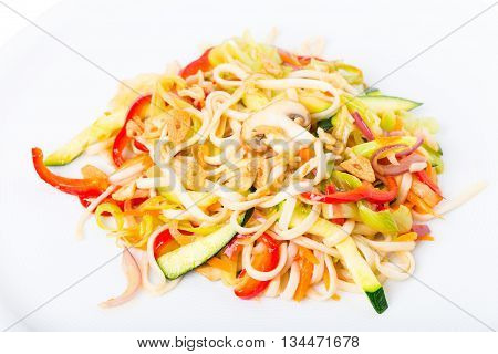 Delicious noodles with vegetables and crispy garlic. Macro. Photo can be used as a whole background.