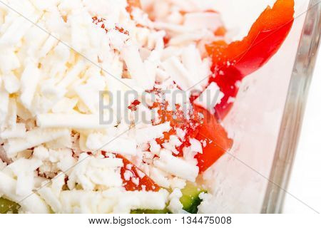 Traditional bulgarian salad shopski with fresh vegetables and grated sheep cheese. Macro. Photo can be used as a whole background.