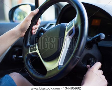 Driver's Hand Holding Car Key For Starting The Car
