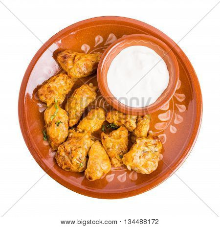 Delicious balkan dolma stuffed with rice and meat. Served with sour cream. Isolated on a white background.