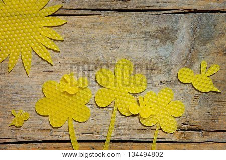 Beeswax, Flowers, Bees And The Sun On Wooden Table