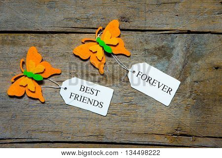 Felty Butterflies And White Signs On Wooden Table, Best Friends Forever