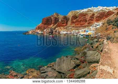 Fishing boats at Old port Ammoudi of Oia village at Santorini island in Aegean sea, Greece